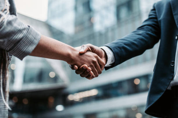 Business partnership handshake